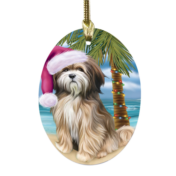Summertime Happy Holidays Christmas Tibetan Terrier Dog on Tropical Island Beach Oval Glass Christmas Ornament OGOR49399
