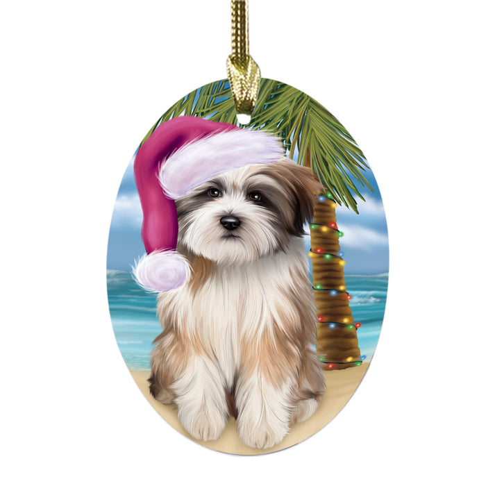 Summertime Happy Holidays Christmas Tibetan Terrier Dog on Tropical Island Beach Oval Glass Christmas Ornament OGOR49401