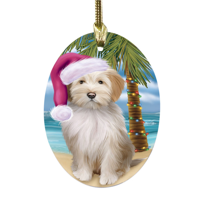 Summertime Happy Holidays Christmas Tibetan Terrier Dog on Tropical Island Beach Oval Glass Christmas Ornament OGOR49403