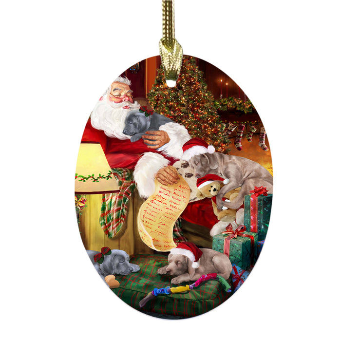 Weimaraners Dog and Puppies Sleeping with Santa Oval Glass Christmas Ornament OGOR49328