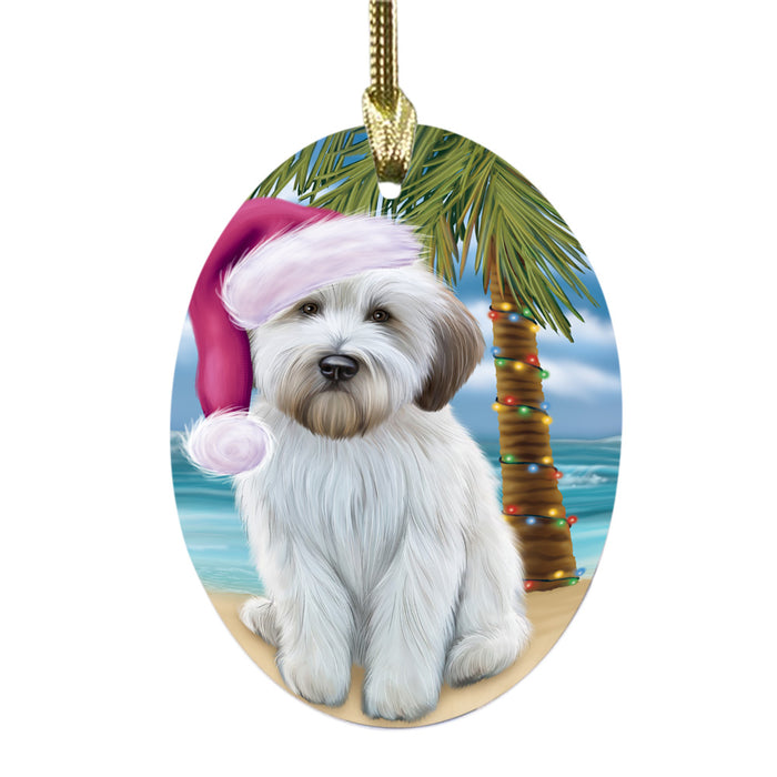 Summertime Happy Holidays Christmas Wheaten Terrier Dog on Tropical Island Beach Oval Glass Christmas Ornament OGOR49408