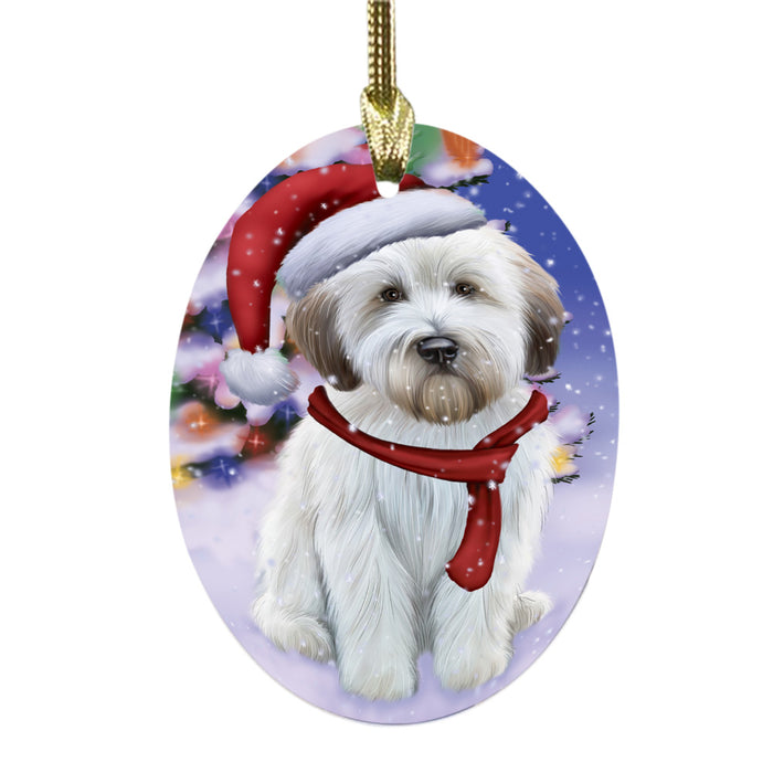 Winterland Wonderland Wheaten Terrier Dog In Christmas Holiday Scenic Background Oval Glass Christmas Ornament OGOR49659