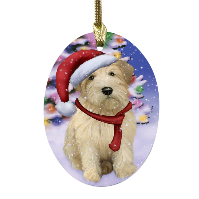 Winterland Wonderland Wheaten Terrier Dog In Christmas Holiday Scenic Background Oval Glass Christmas Ornament OGOR49660