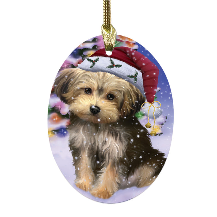 Winterland Wonderland Yorkipoo Dog In Christmas Holiday Scenic Background Oval Glass Christmas Ornament OGOR49664