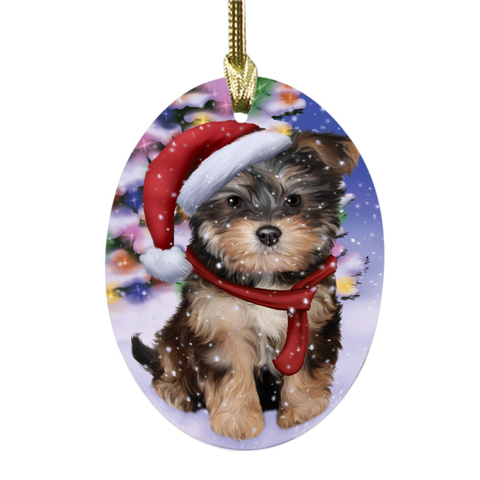 Winterland Wonderland Yorkipoo Dog In Christmas Holiday Scenic Background Oval Glass Christmas Ornament OGOR49666