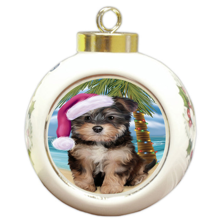 Summertime Happy Holidays Christmas Yorkipoo Dog on Tropical Island Beach Round Ball Christmas Ornament RBPOR54602