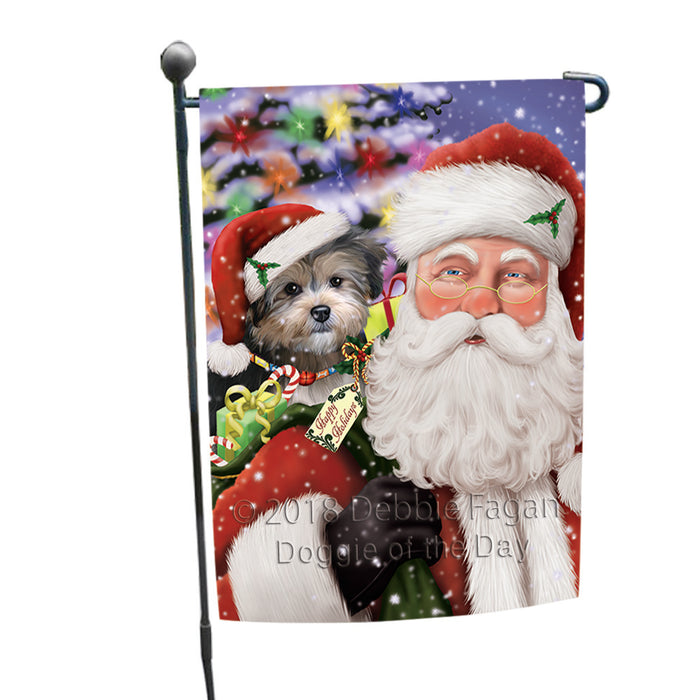 Santa Carrying Yorkipoo Dog and Christmas Presents Garden Flag GFLG53778