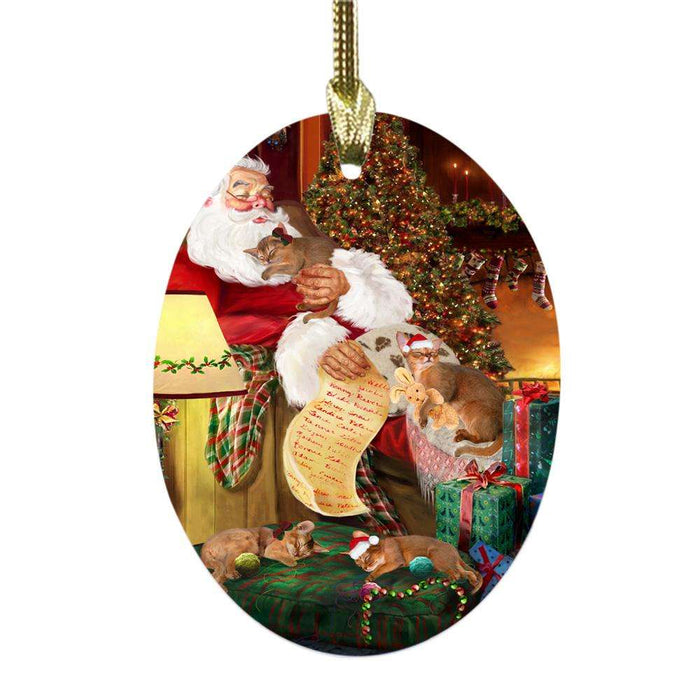 Abyssinian Cats and Kittens Sleeping with Santa Oval Glass Christmas Ornament OGOR49230