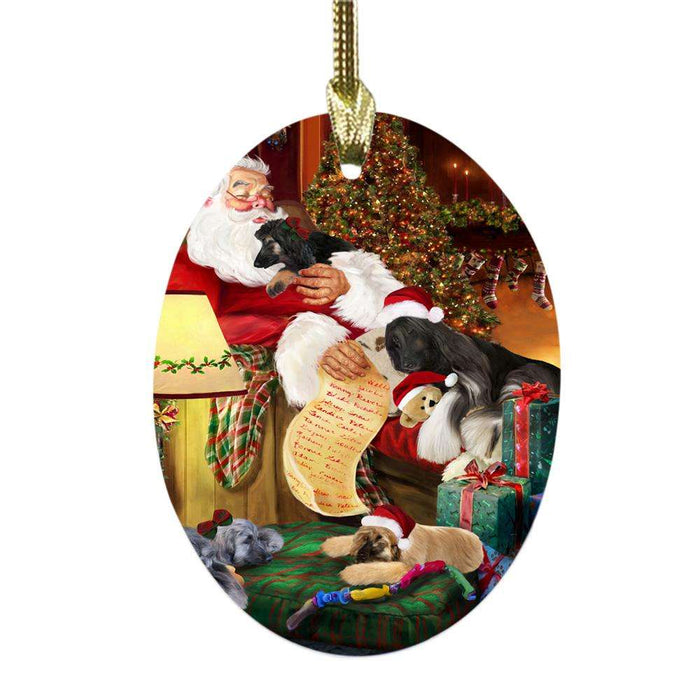 Afghan Hounds Dog and Puppies Sleeping with Santa Oval Glass Christmas Ornament OGOR49231