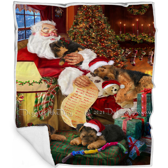 Airedale Dog and Puppies Sleeping with Santa Blanket