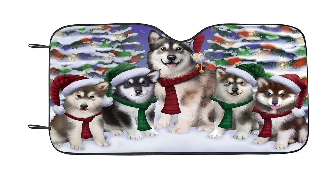 Alaskan Malamute Dogs Christmas Family Portrait in Holiday Scenic Background Car Sun Shade