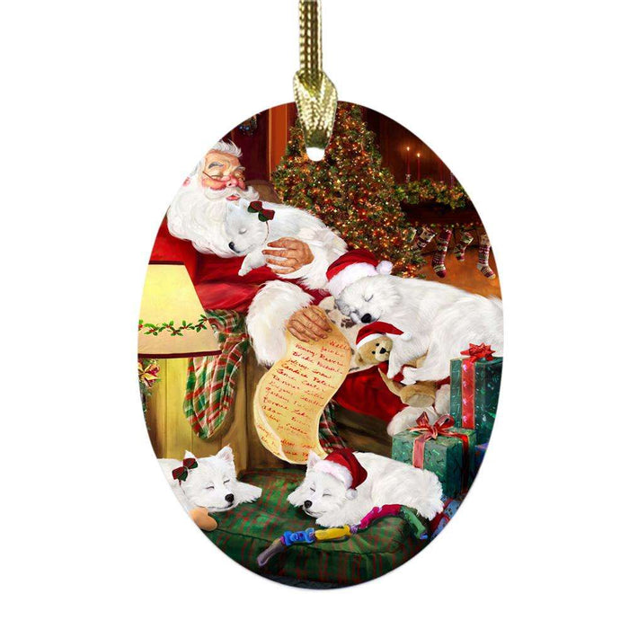 American Eskimos Dog and Puppies Sleeping with Santa Oval Glass Christmas Ornament OGOR49236