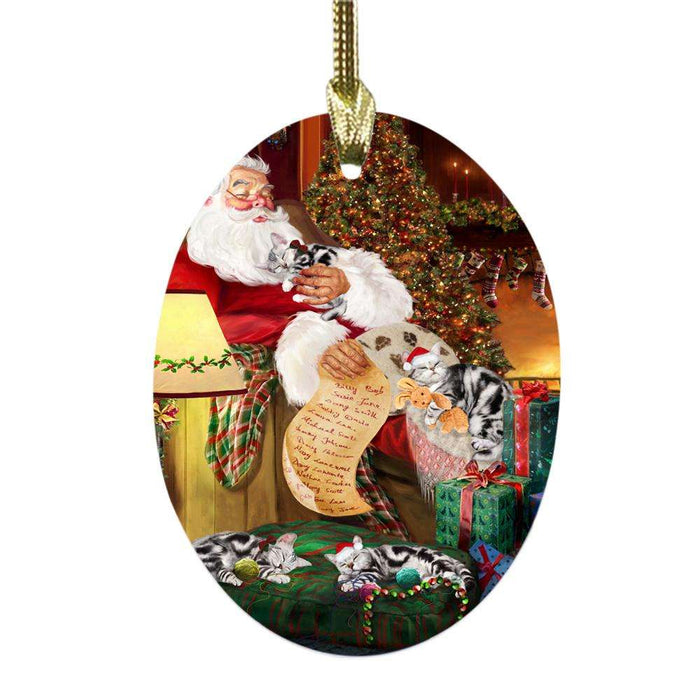 American Staffordshire Terriers Dog and Puppies Sleeping with Santa Oval Glass Christmas Ornament OGOR49237