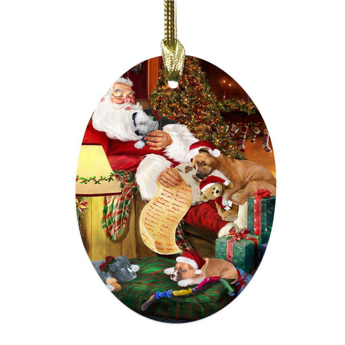 American Staffordshire Terriers Dog and Puppies Sleeping with Santa Oval Glass Christmas Ornament OGOR49238