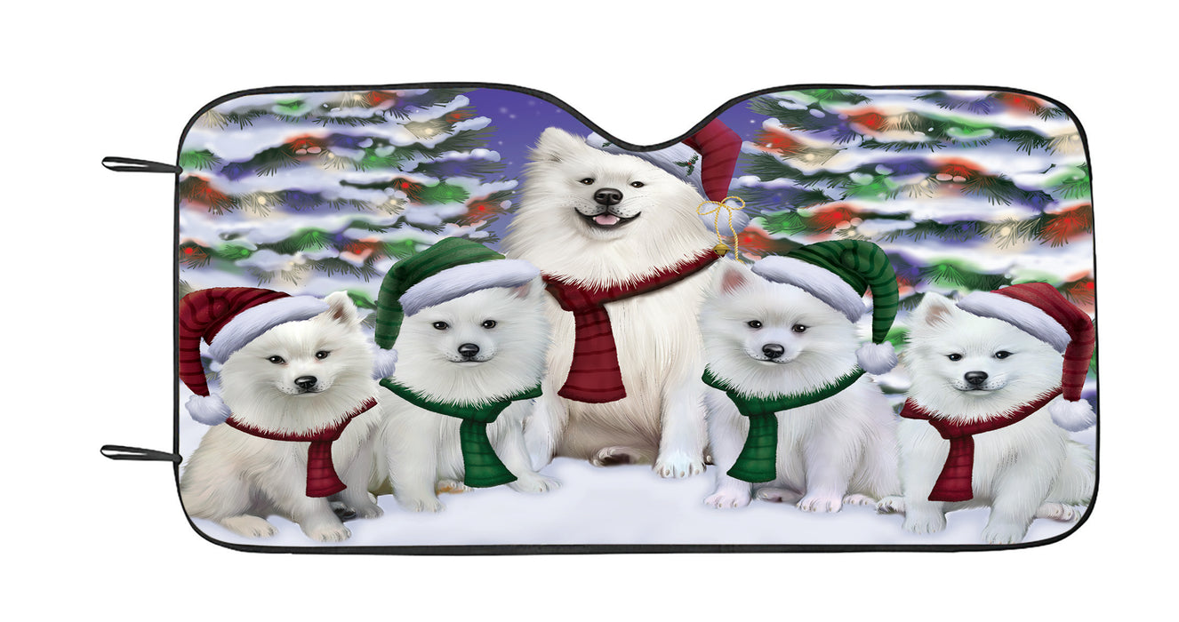 American Eskimo Dogs Christmas Family Portrait in Holiday Scenic Background Car Sun Shade