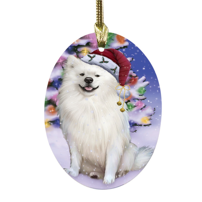 Winterland Wonderland American Eskimo Dog In Christmas Holiday Scenic Background Oval Glass Christmas Ornament OGOR49486