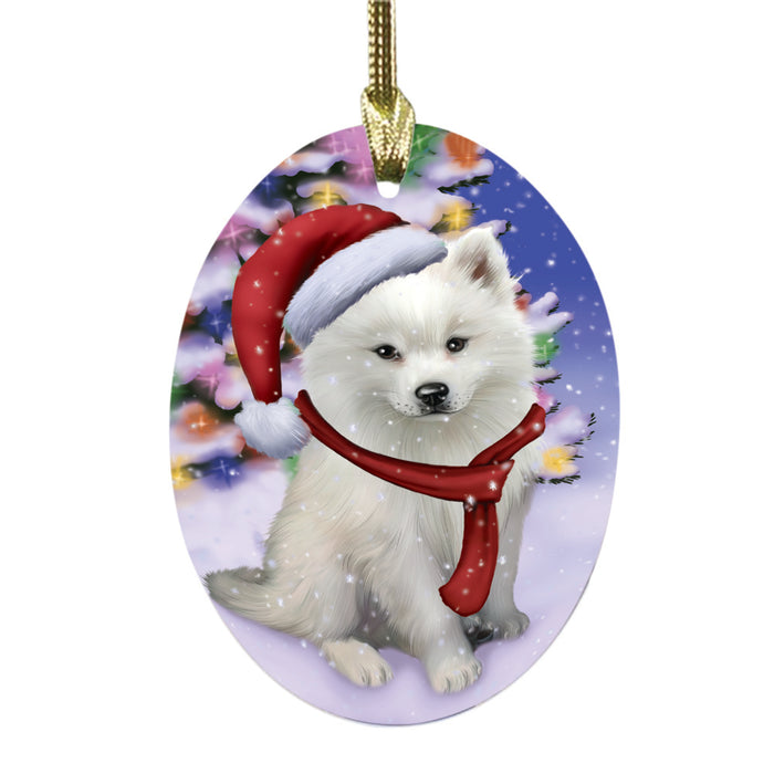 Winterland Wonderland American Eskimo Dog In Christmas Holiday Scenic Background Oval Glass Christmas Ornament OGOR49487