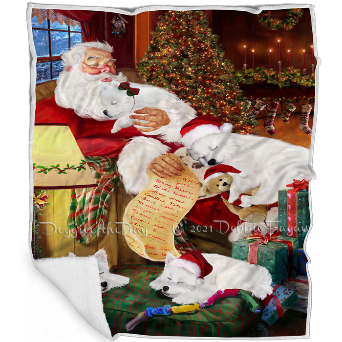 Eskimo Dog and Puppies Sleeping with Santa Blanket