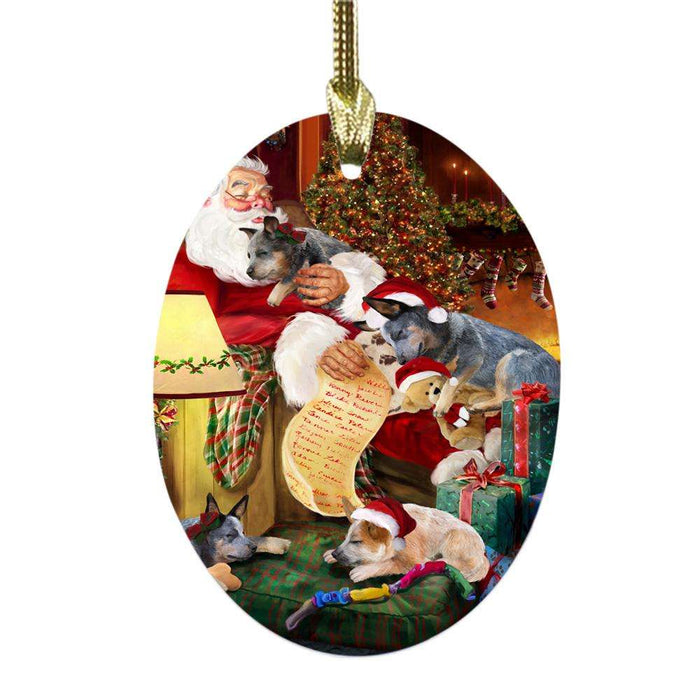 Australian Cattle Dogs and Puppies Sleeping with Santa Oval Glass Christmas Ornament OGOR49240