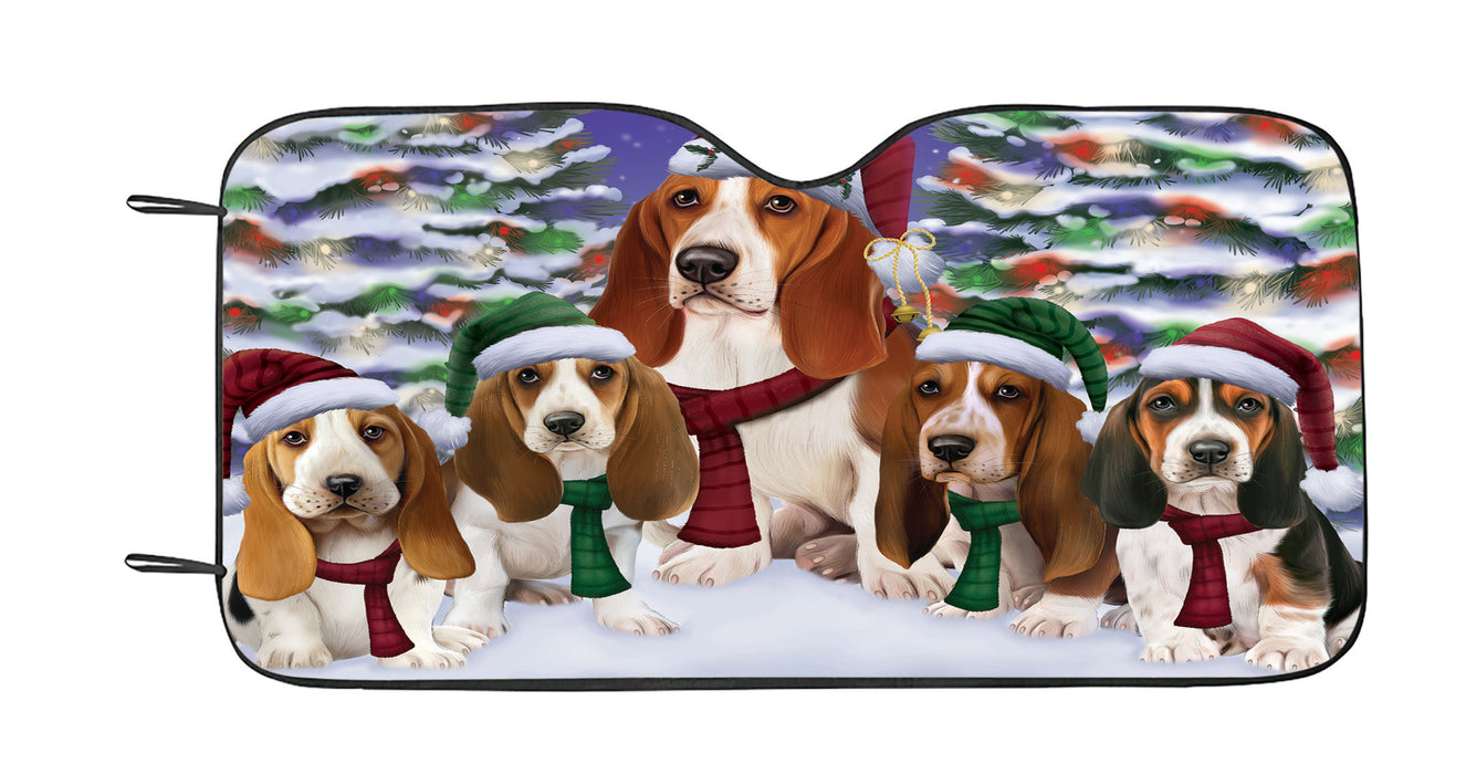 Basset Hound Dogs Christmas Family Portrait in Holiday Scenic Background Car Sun Shade