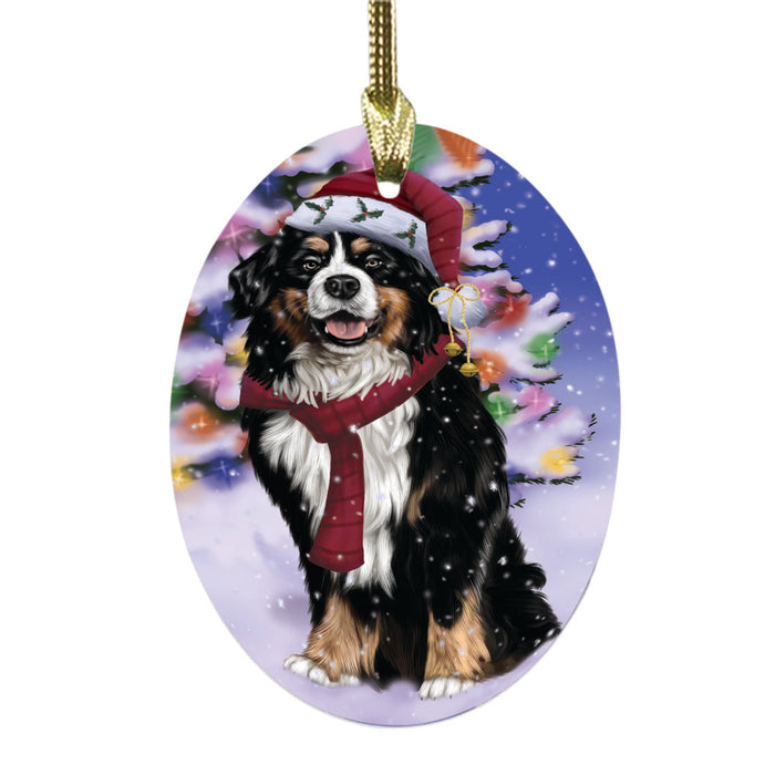 Winterland Wonderland Bernese Mountain Dog In Christmas Holiday Scenic Background Oval Glass Christmas Ornament OGOR49519