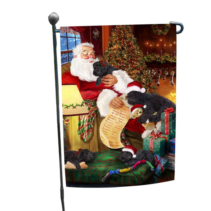 Black Russian Terrier Dog and Puppies Sleeping with Santa Garden Flag
