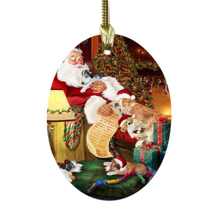 Borzois Dog and Puppies Sleeping with Santa Oval Glass Christmas Ornament OGOR49256