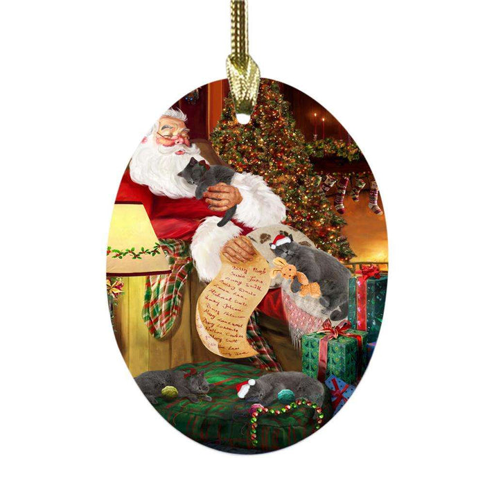 British Shorthair Cats and Kittens Sleeping with Santa Oval Glass Christmas Ornament OGOR49261