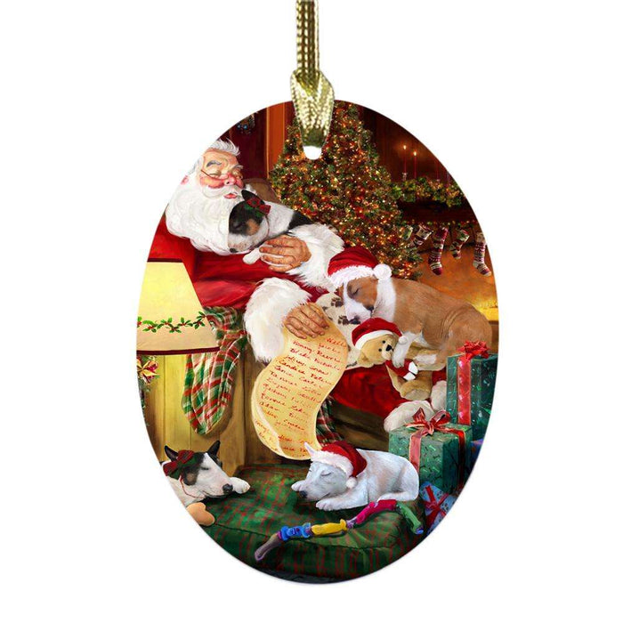 Brittany Spaniels Dog and Puppies Sleeping with Santa Oval Glass Christmas Ornament OGOR49263