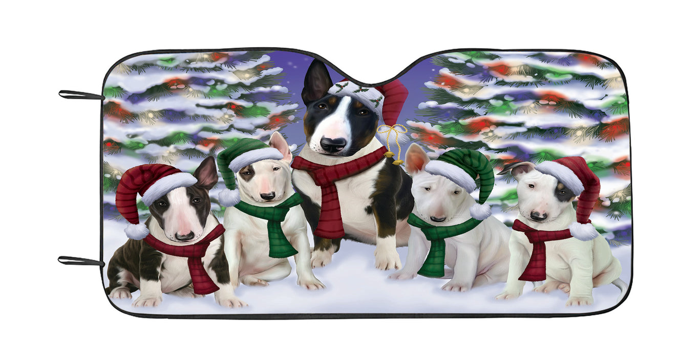 Bull Terrier Dogs Christmas Family Portrait in Holiday Scenic Background Car Sun Shade