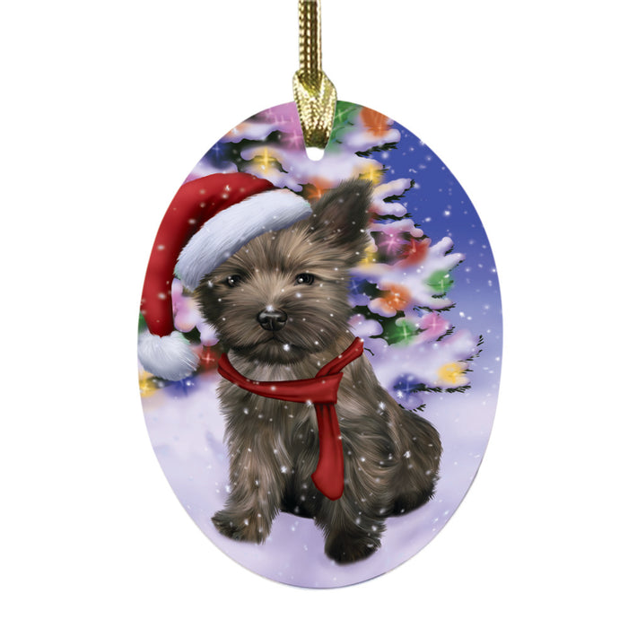 Winterland Wonderland Cairn Terrier Dog In Christmas Holiday Scenic Background Oval Glass Christmas Ornament OGOR49547