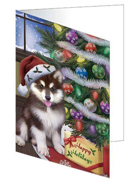 Christmas Happy Holidays Alaskan Malamute Dog with Tree and Presents Handmade Artwork Assorted Pets Greeting Cards and Note Cards with Envelopes for All Occasions and Holiday Seasons GCD65423