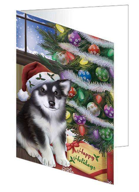 Christmas Happy Holidays Alaskan Malamute Dog with Tree and Presents Handmade Artwork Assorted Pets Greeting Cards and Note Cards with Envelopes for All Occasions and Holiday Seasons GCD65426