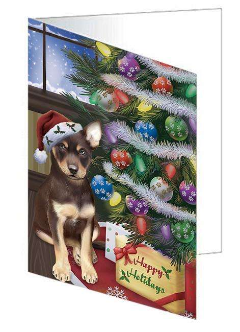Christmas Happy Holidays Australian Kelpie Dog with Tree and Presents Handmade Artwork Assorted Pets Greeting Cards and Note Cards with Envelopes for All Occasions and Holiday Seasons GCD65429