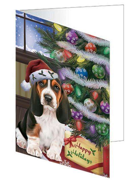 Christmas Happy Holidays Basset Hound Dog with Tree and Presents Handmade Artwork Assorted Pets Greeting Cards and Note Cards with Envelopes for All Occasions and Holiday Seasons GCD65432