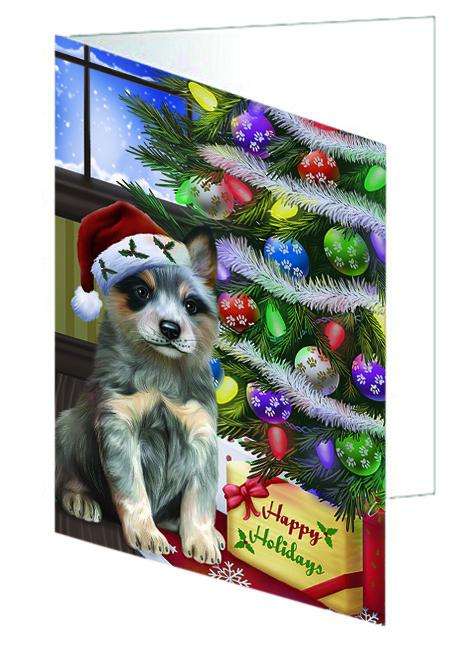Christmas Happy Holidays Blue Heeler Dog with Tree and Presents Handmade Artwork Assorted Pets Greeting Cards and Note Cards with Envelopes for All Occasions and Holiday Seasons GCD64370