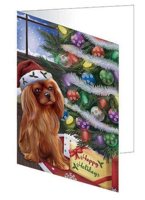 Christmas Happy Holidays Cavalier King Charles Spaniel Dog with Tree and Presents Handmade Artwork Assorted Pets Greeting Cards and Note Cards with Envelopes for All Occasions and Holiday Seasons GCD65474