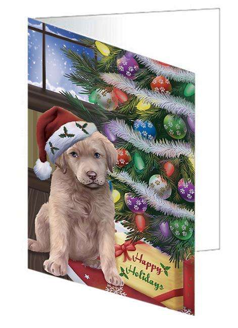 Christmas Happy Holidays Chesapeake Bay Retriever Dog with Tree and Presents Handmade Artwork Assorted Pets Greeting Cards and Note Cards with Envelopes for All Occasions and Holiday Seasons GCD65480