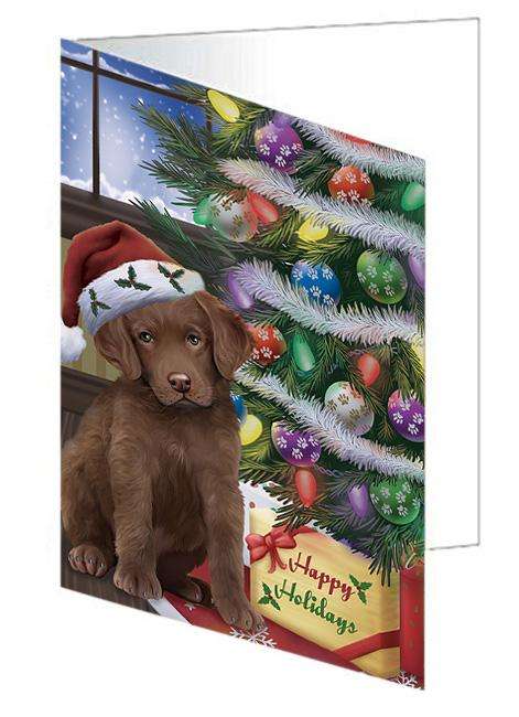 Christmas Happy Holidays Chesapeake Bay Retriever Dog with Tree and Presents Handmade Artwork Assorted Pets Greeting Cards and Note Cards with Envelopes for All Occasions and Holiday Seasons GCD65483