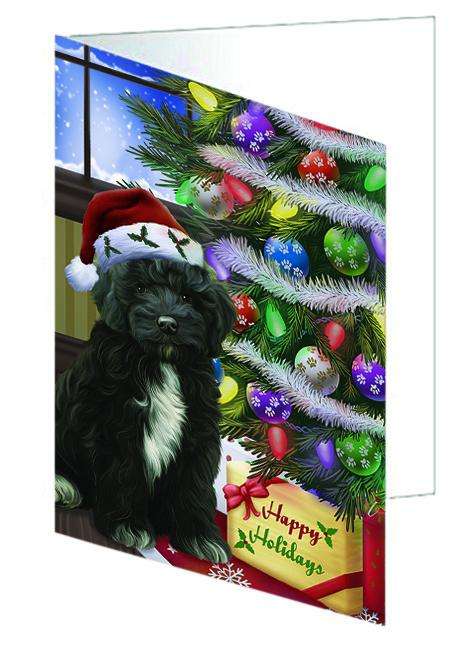 Christmas Happy Holidays Cockapoo Dog with Tree and Presents Handmade Artwork Assorted Pets Greeting Cards and Note Cards with Envelopes for All Occasions and Holiday Seasons GCD64379