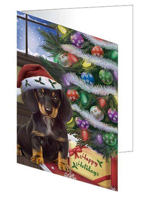Christmas Happy Holidays Dachshund Dog with Tree and Presents Handmade Artwork Assorted Pets Greeting Cards and Note Cards with Envelopes for All Occasions and Holiday Seasons GCD65513