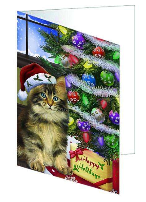 Christmas Happy Holidays Maine Coon Cat with Tree and Presents Handmade Artwork Assorted Pets Greeting Cards and Note Cards with Envelopes for All Occasions and Holiday Seasons GCD64418