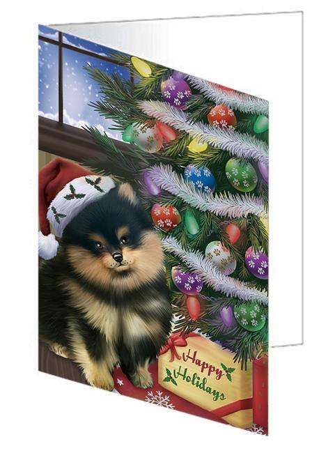 Christmas Happy Holidays Pomeranian Dog with Tree and Presents Handmade Artwork Assorted Pets Greeting Cards and Note Cards with Envelopes for All Occasions and Holiday Seasons GCD65567