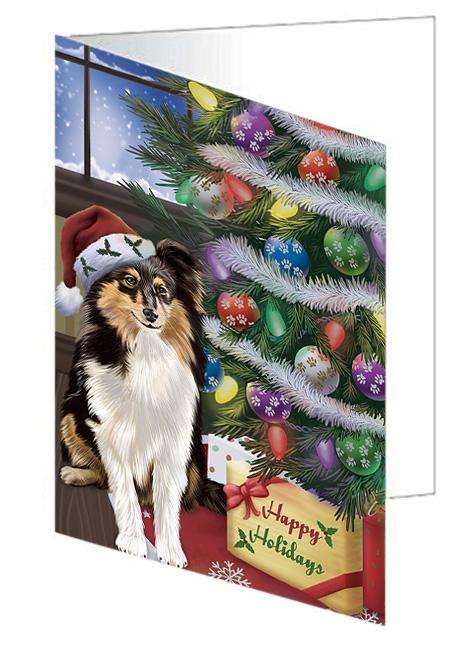 Christmas Happy Holidays Shetland Sheepdog with Tree and Presents Handmade Artwork Assorted Pets Greeting Cards and Note Cards with Envelopes for All Occasions and Holiday Seasons GCD65606