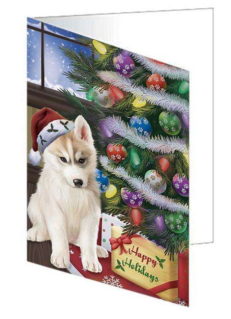 Christmas Happy Holidays Siberian Husky Dog with Tree and Presents Handmade Artwork Assorted Pets Greeting Cards and Note Cards with Envelopes for All Occasions and Holiday Seasons GCD65618