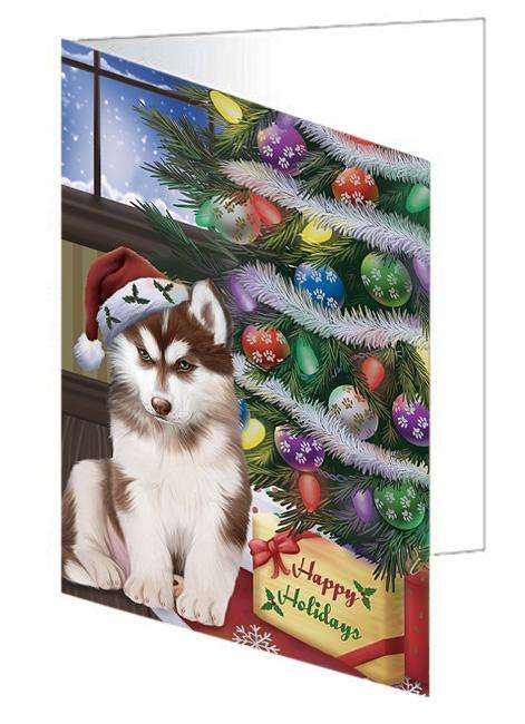 Christmas Happy Holidays Siberian Husky Dog with Tree and Presents Handmade Artwork Assorted Pets Greeting Cards and Note Cards with Envelopes for All Occasions and Holiday Seasons GCD65621