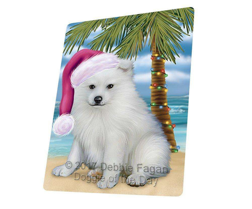 Christmas Happy Holidays Summer Time American Eskimo Puppy on Beach Wearing Santa Hat Cutting Board CUTB414