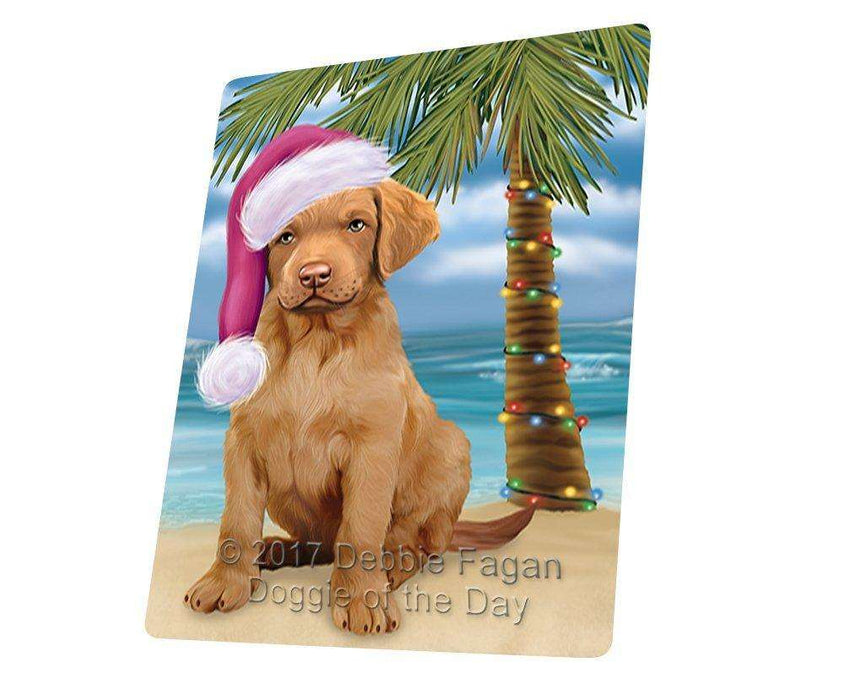 Christmas Happy Holidays Summer Time Chesapeake Bay Retriever Puppy on Beach Wearing Santa Hat Cutting Board CUTB435