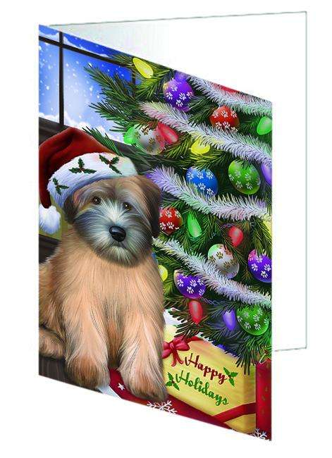 Christmas Happy Holidays Wheaten Terrier Dog with Tree and Presents Handmade Artwork Assorted Pets Greeting Cards and Note Cards with Envelopes for All Occasions and Holiday Seasons GCD64466