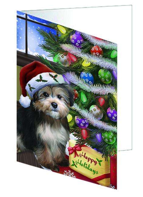 Christmas Happy Holidays Yorkipoo Dog with Tree and Presents Handmade Artwork Assorted Pets Greeting Cards and Note Cards with Envelopes for All Occasions and Holiday Seasons GCD64478